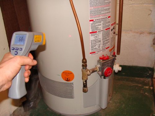 Infrared thermometer pointed at water heater