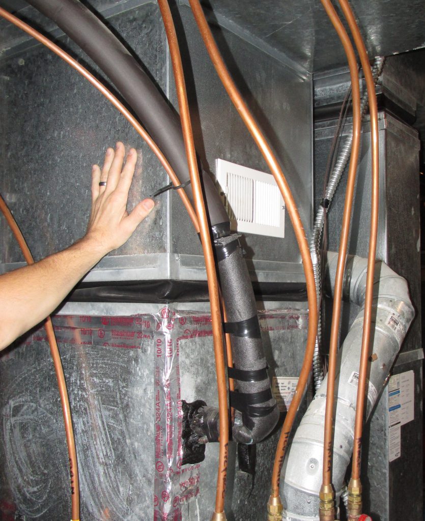 hand on furnace plenum