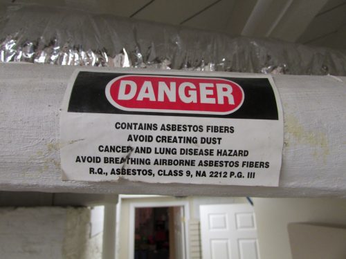 Asbestos insulation on pipe wrap