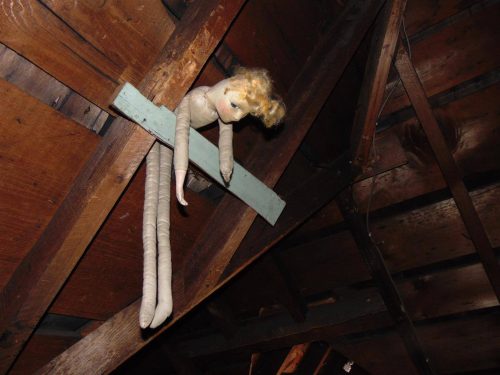 Creepy doll in attic