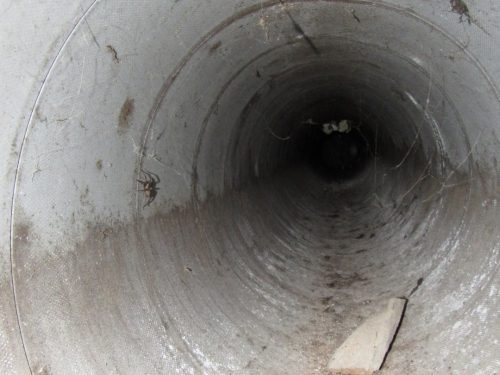 transite duct with water stains