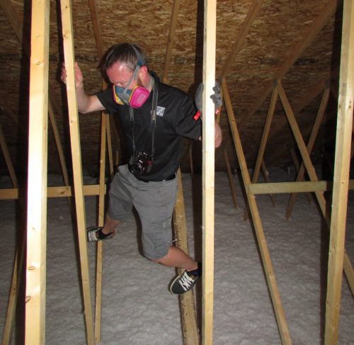 Bryce inspecting an attic