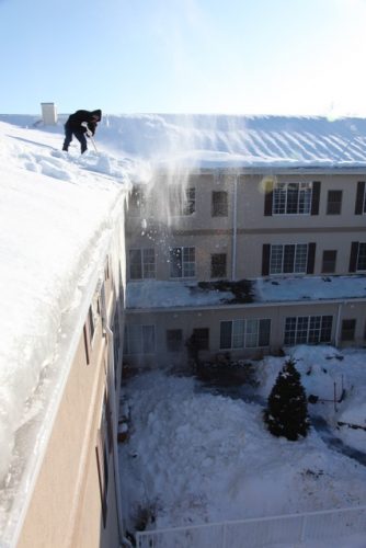 shoveling a tall roof