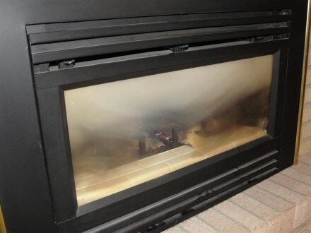 Dirty glass at gas fireplace