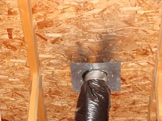 bathroom exhaust fan vent into attic