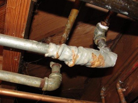 Duct tape repair on galvanized pipe