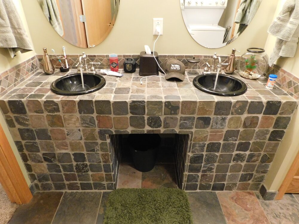 DIY vanity. Let’s hope someone got those drain connections right, because there is no way to access anything underneath it.