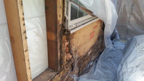 Rotted wall below new window