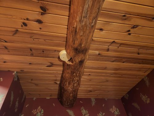 Smoke alarm cut into beam