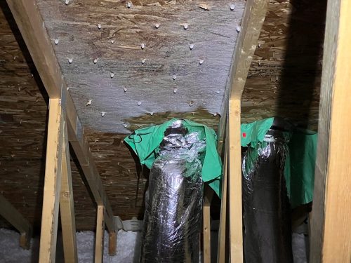 Loose bath fan duct at roof sheathing