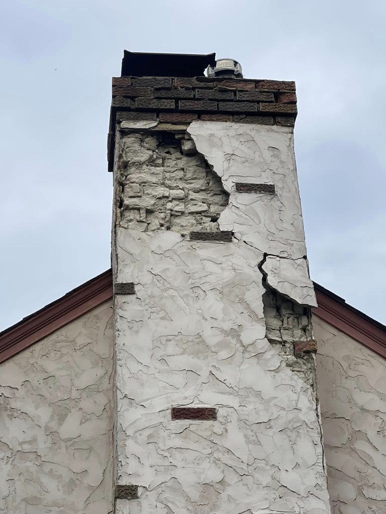 Stucco-covered brick chimney