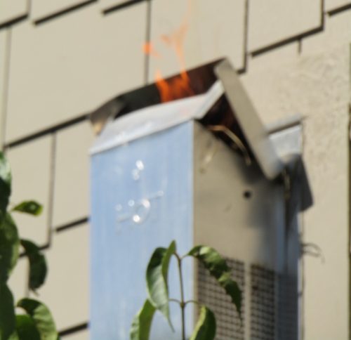 Flames coming out of fireplace vent